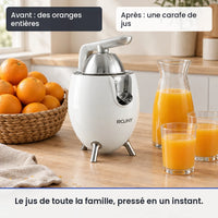 Avant/après avec le extracteur de jus ROUNY 850W inox agrumes : des oranges entières, puis une carafe de jus