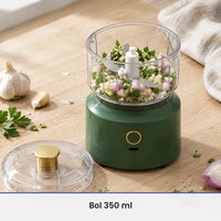 Bol transparent de 350 ml rempli d'ail, d'échalote et de persil sur le socle vert sapin, couvercle à poussoir doré à côté