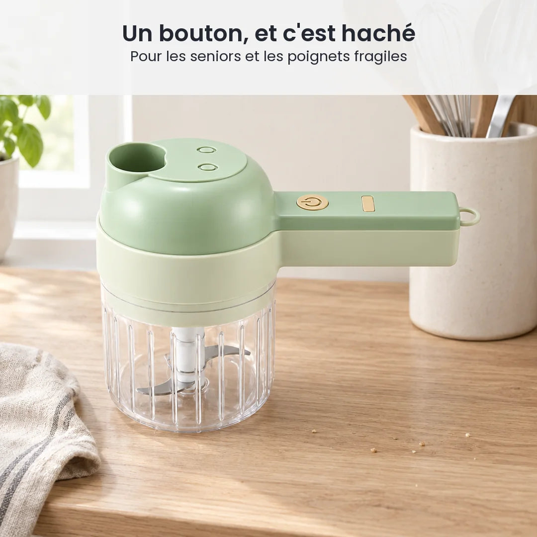 Hachoir électrique 4 en 1 sans fil vert pâle rangé sur un plan de travail clair, à côté d'un pot d'ustensiles en bois