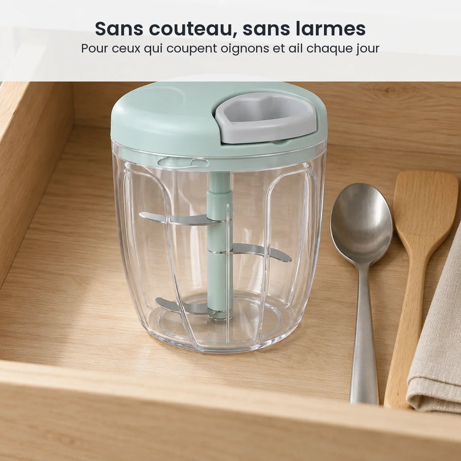 Hachoir manuel à ficelle 900 ml vert menthe rangé dans un tiroir de cuisine, à côté d'une cuillère et d'une spatule en bois