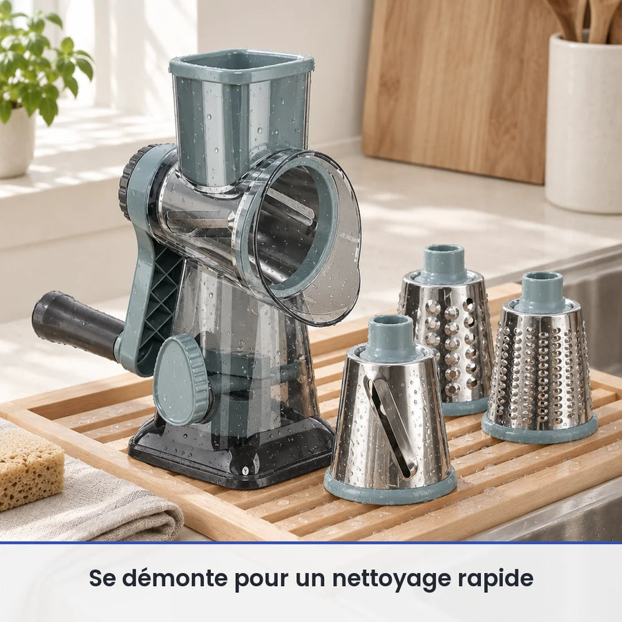 Râpe rotative gris bleuté et ses trois tambours inox lavés à la main, posés sur un égouttoir en bois près d'un évier