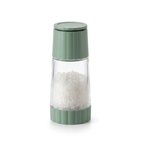 Moulin à sel rotatif, pot en verre et capot vert, vue produit sur fond blanc